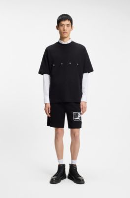 Halfhoge laarzen van leer met gestructureerde panelen, Zwart