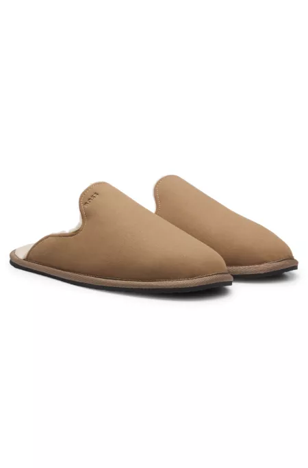 Shearling-lined slip-on slippers with logo detail