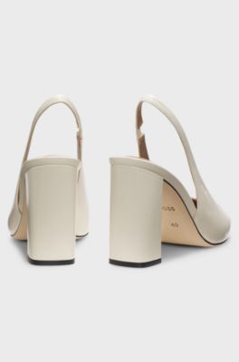 Heeled pumps in leather with slingback strap, Natural