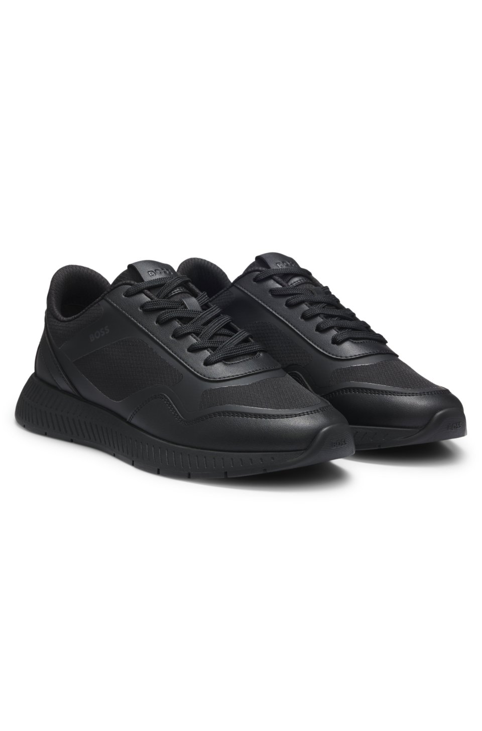 Mixed-material trainers with ridged outsole