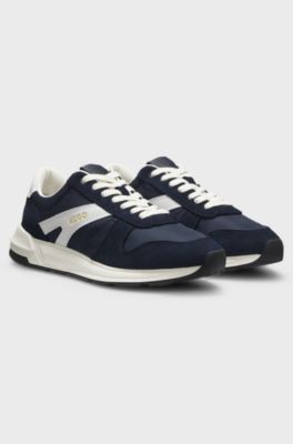 Sneakers med mockadetaljer och loggor, M&ouml;rkbl&aring;