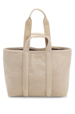 Tote bag in textured fabric with rubber logo