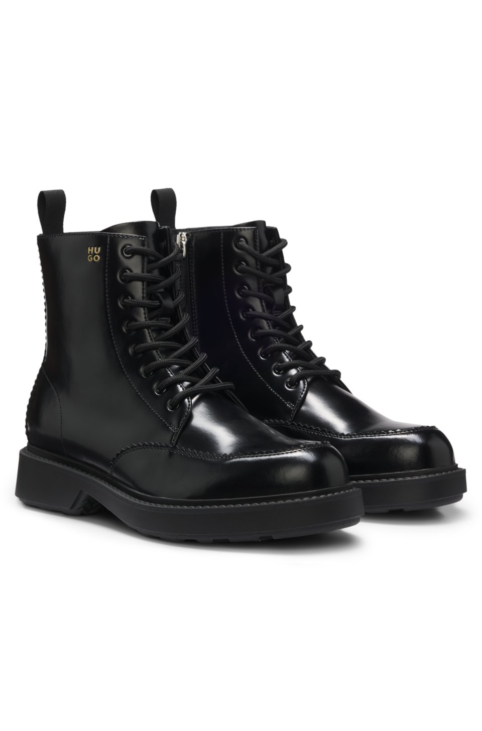 Lace-up leather boots with debossed logo