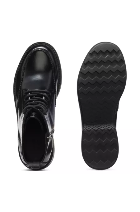 Lace-up leather boots with debossed logo