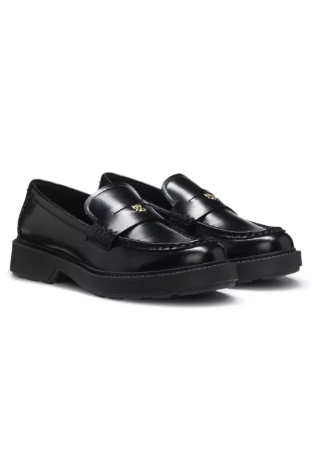 Leather loafers with penny trim and stacked logo