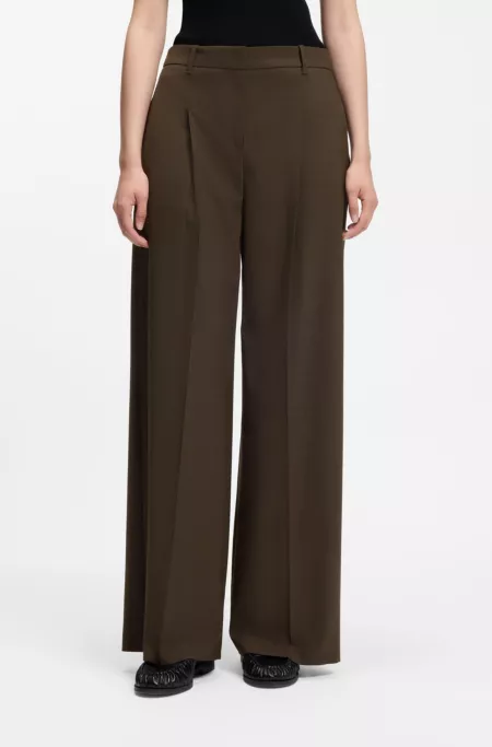 Wide-leg trousers in stretch fabric with front pleats