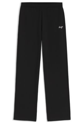 Relaxed-fit tracksuit bottoms in cotton with script logo, Black