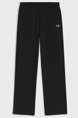 Relaxed-fit tracksuit bottoms in cotton with script logo, Black