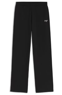 Relaxed-fit tracksuit bottoms in cotton with script logo, Black