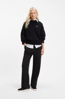 Relaxed-fit tracksuit bottoms in cotton with script logo, Black
