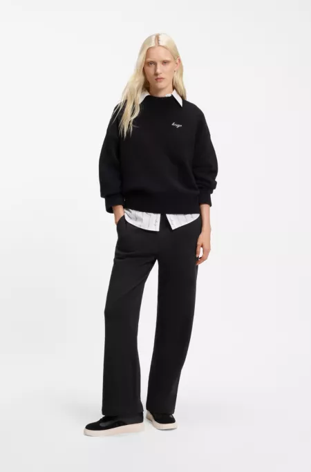 Relaxed-fit tracksuit bottoms in cotton with script logo