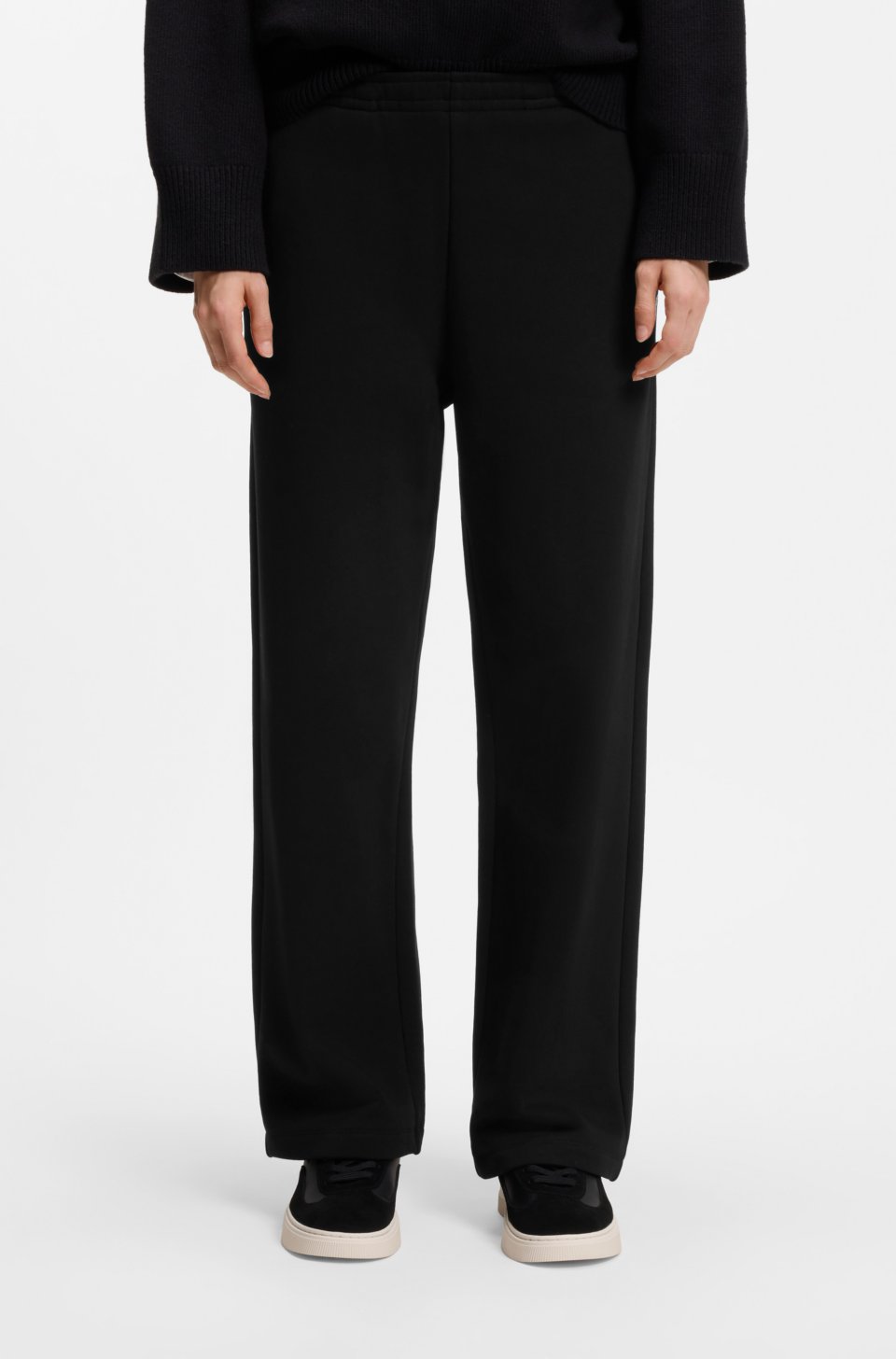 Relaxed-fit tracksuit bottoms in cotton with script logo