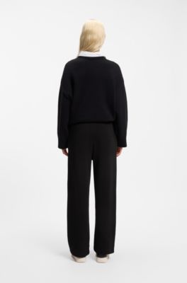 Relaxed-fit tracksuit bottoms in cotton with script logo, Black