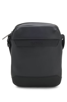 Reporter bag in faux leather with piqué detailing