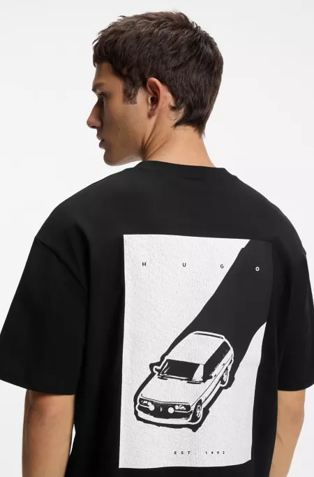 Camiseta oversize fit de algodón con ilustración en la espalda
