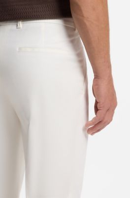 Pantaloni con fit affusolato in misto cotone, Bianco