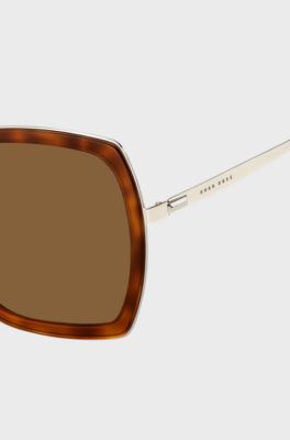 Angular sunglasses with Havana frames and signature hardware, Brown Patterned