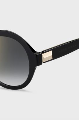Round sunglasses in black acetate with signature hardware, Black