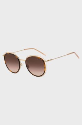 Round sunglasses in Havana acetate with nude sheath, Brown Patterned