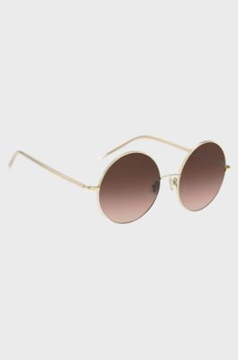 Round sunglasses in gold-tone titanium, Gold