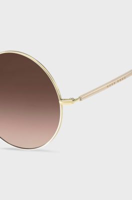 Round sunglasses in gold-tone titanium, Gold
