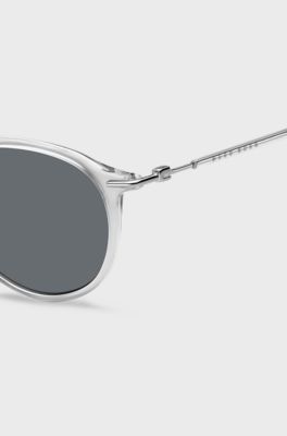 Clear-acetate sunglasses with plastic sleeves, Transparent
