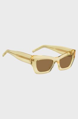 Lunettes de soleil en ac&eacute;tate transparent avec garnitures en m&eacute;tal embl&eacute;matiques, Transparent