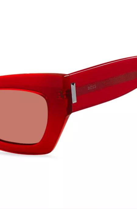 Red-acetate sunglasses with signature hardware