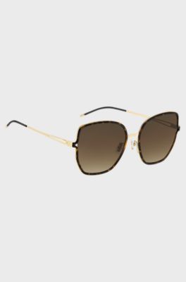 Black-frame sunglasses with forked temples and branded chain, Black