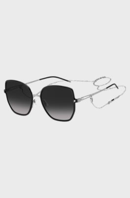 Black-frame sunglasses with forked temples and branded chain, Black