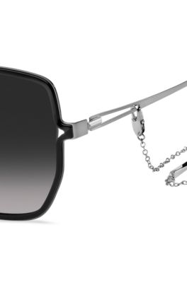 Black-frame sunglasses with forked temples and branded chain, Black