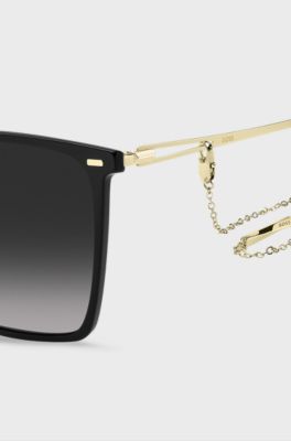 Black-frame sunglasses with forked temples and branded chain, Assorted-Pre-Pack