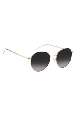 Round-frame sunglasses in lightweight titanium, Gold