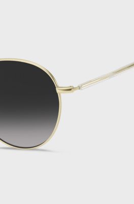 Round-frame sunglasses in lightweight titanium, Gold