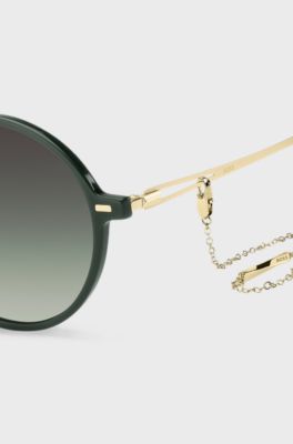 Round-frame sunglasses in green acetate with branded chain, Green