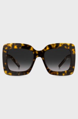 Lunettes de soleil en ac&eacute;tate Havana avec garnitures en m&eacute;tal embl&eacute;matiques, Noir &agrave; motif