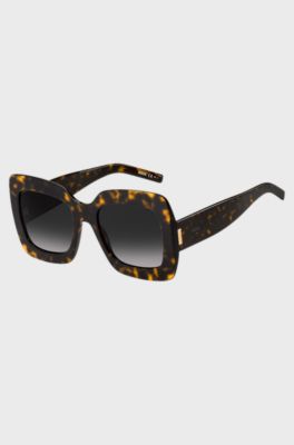 Lunettes de soleil en ac&eacute;tate Havana avec garnitures en m&eacute;tal embl&eacute;matiques, Noir &agrave; motif