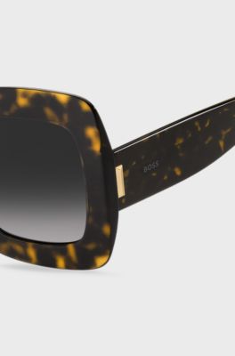 Lunettes de soleil en ac&eacute;tate Havana avec garnitures en m&eacute;tal embl&eacute;matiques, Noir &agrave; motif
