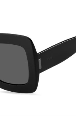 Black-acetate sunglasses with signature hardware, Black