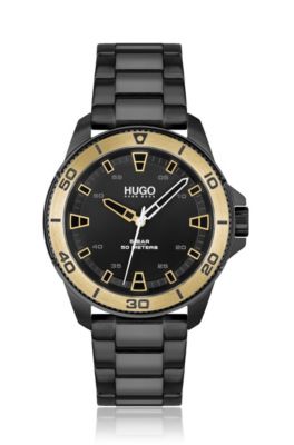 Black-plated watch with gold-toned bezel, Black