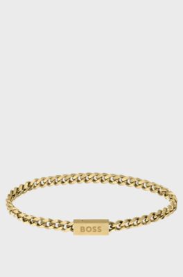 Gold-tone chain cuff with logo closure, Gold tone