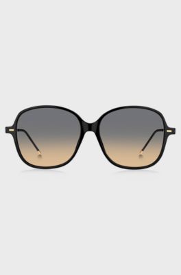 Black-acetate sunglasses with gold temples and chain strap, Black