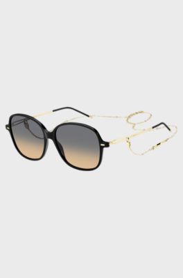 Black-acetate sunglasses with gold temples and chain strap, Black