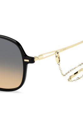 Black-acetate sunglasses with gold temples and chain strap, Black