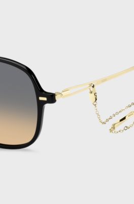 Black-acetate sunglasses with gold temples and chain strap, Black
