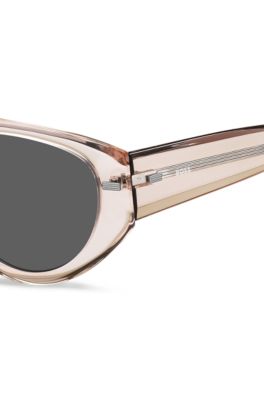 Translucent pink bio-acetate sunglasses with patterned rivets, light pink