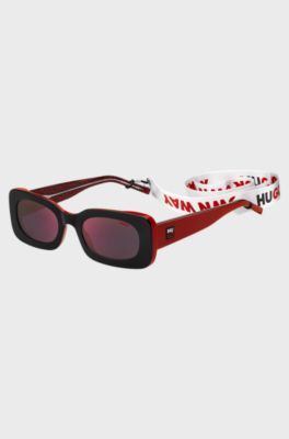 Gafas de sol de acetato negro y rojo con esl&oacute;ganes en la correa desmontable, Rojo