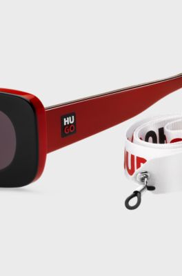 Gafas de sol de acetato negro y rojo con esl&oacute;ganes en la correa desmontable, Rojo