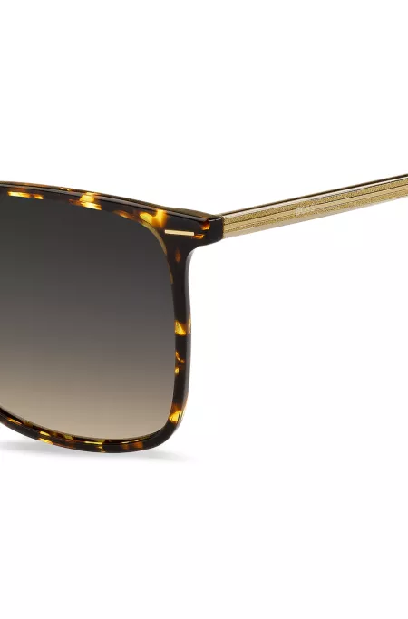 Horn-acetate sunglasses with lasered branding