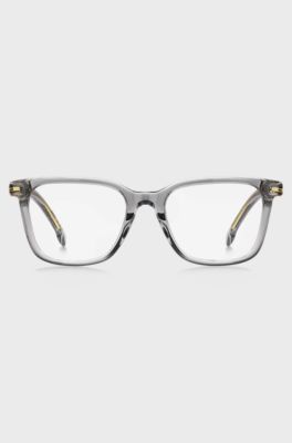 Clear-acetate optical frames with signature gold-tone detail, Transparent